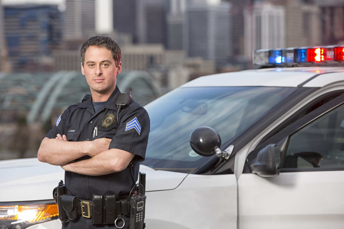 Sergeant next to police car